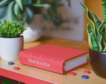 Four in a Row | Foldable Book-Style Game | Compact Family Travel Game | Unique Coffee Table Gift