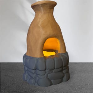 May include: A ceramic fire pit with a stone base. The fire pit is brown and has a round opening in the front. The base is gray and has a textured stone design.