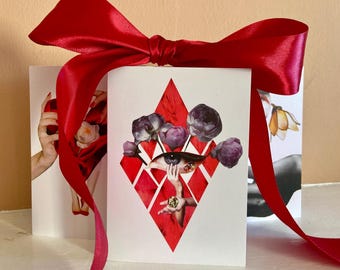 May include: A stack of white cards tied with a bright red satin ribbon. The front card features a collage with a red diamond shape, an eye, hands, and purple flowers. The other cards have images of hands and flowers.