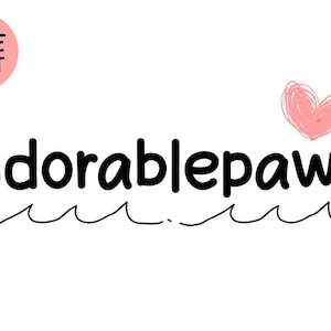 May include: White background with the word "Adorablepaws" in black, handwritten-style font. A pink heart and a pink circle with "Cute Font" are also present. A wavy line underlines the word.