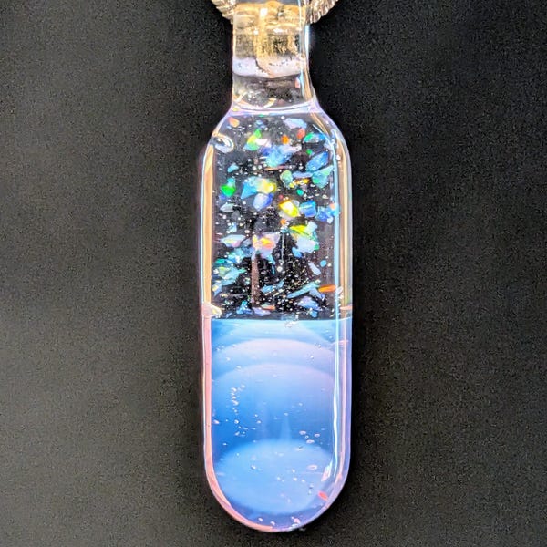 Crushed opal capsule pendant handmade from borosilicate glass. Comes with necklace and box.