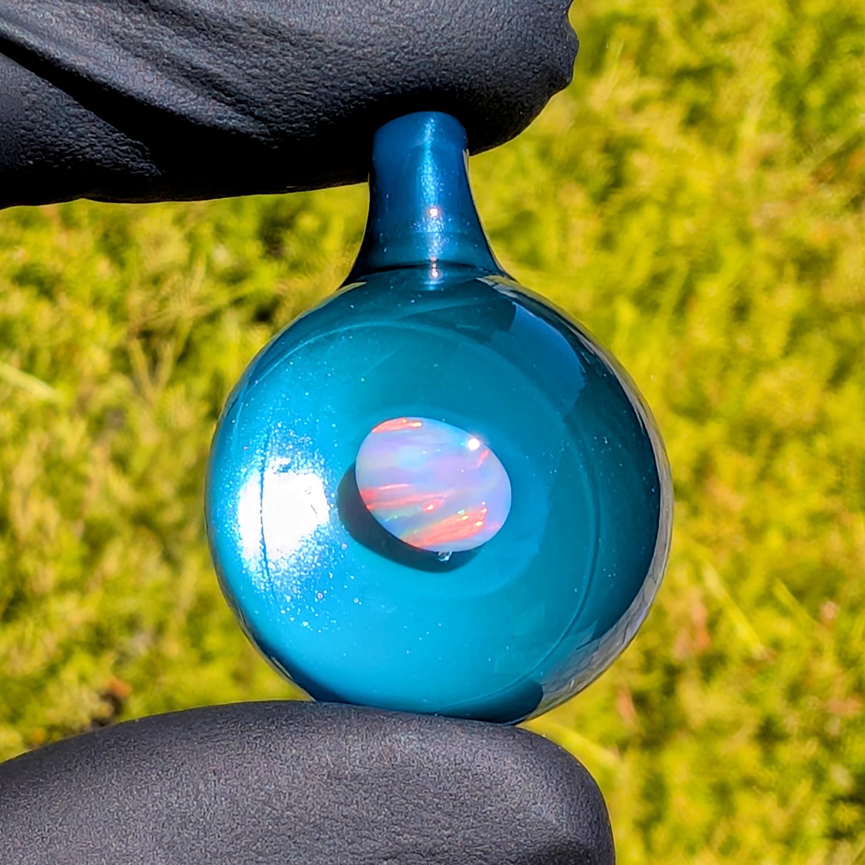 Metallic-blue "Neptunium" + opal pendant -- borosilicate blass.  Comes with necklace and box.