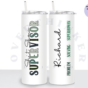 May include: Two white stainless steel tumblers with lids and straws. The tumbler on the left has the text "Shift Supervisor" in black, green, and grey. The tumbler on the right has the text "Richard Problem Solving Superhuman" in black and green.