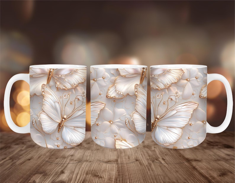 May include: White ceramic mug featuring a 3D butterfly design with gold accents. The butterflies are set against a background of white flowers and gold embellishments. The mug has a white handle.