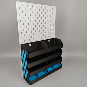 Portable 3D printed vendor display with tiered shelves and storage trays for craft fairs and conventions