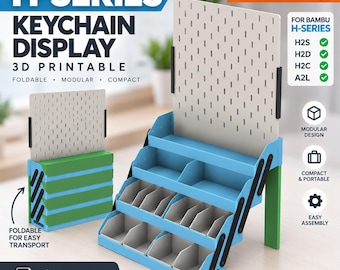 May include: A 3D printable H-Series keychain display featuring a foldable, modular, and compact design. The unit includes a light gray pegboard back panel, blue tiered shelving with gray dividers, and green support legs for organization and display.