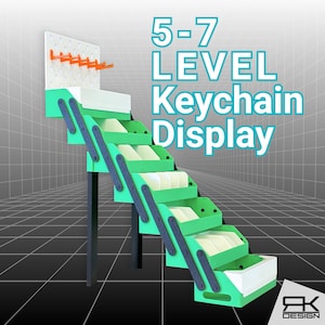 May include: A multi-level keychain display stand featuring a tiered staircase design with bright green steps and white inserts. The structure is supported by dark gray side panels and black legs, with a white pegboard top featuring orange hooks. Text reads 5-7 LEVEL Keychain Display.