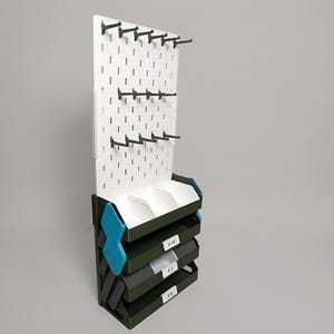 Rear view of the foldable keychain display showing compact folded transport position