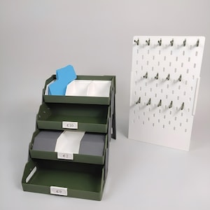 Foldable keychain display with removable trays and pegboard accessory panel