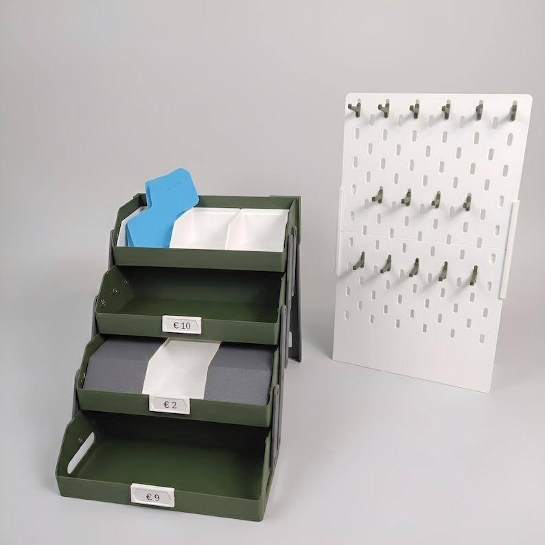 Foldable keychain display with removable trays and pegboard accessory panel