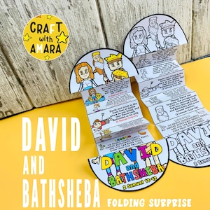 May include: A folded paper craft with the text "DAVID AND BATHSHEBA" and illustrations. The craft is yellow, white, and blue. The text "FOLDING SURPRISE" is at the bottom. A yellow sticker with the text "CRAFT with AMARA" is in the upper left corner.