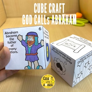 May include: Two white cube crafts with illustrations and text. One cube shows a cartoon figure and the text "Abraham became the father of many nations." The other cube has a scroll illustration and text.