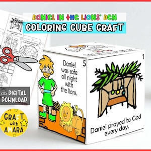 May include: A white cube craft with illustrations and text from the story of Daniel in the Lion's Den. The cube features images of Daniel, lions, and the text "Daniel was safe all night with the lions." and "Daniel prayed to God every day."