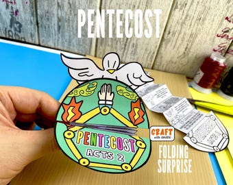 May include: A colorful Pentecost-themed craft with the word "Pentecost" in large white letters. The craft features a dove, flames, and the text "Acts 2." The words "Craft with Amara" and "Folding Surprise" are also visible.