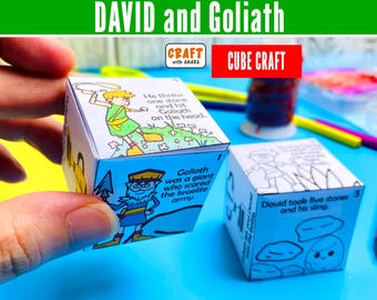 May include: Two paper cube crafts featuring the story of David and Goliath. One cube is colored with illustrations of David and Goliath and text including 'He threw one stone and hit Goliath on the head' and 'Goliath was a giant who scared the Israelite army.'