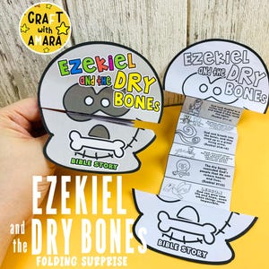 May include: A white and black folding surprise featuring the text "Ezekiel and the Dry Bones" and a skull and bone design. The Bible story is printed on the inside. The words "Bible Story" are also visible.