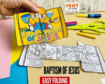May include: A paper craft project titled Baptism of Jesus featuring a colored illustration of Jesus with a cross and bread, alongside black and white coloring pages that fold out to reveal a comic strip depicting the baptism scene with text.