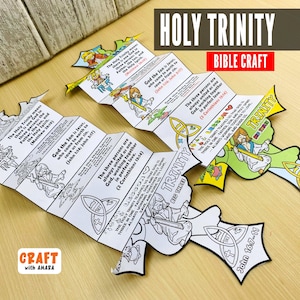 May include: Two unfolded Bible craft projects with the words "Holy Trinity" and "Bible Craft" at the top. The crafts are in the shape of a cross and feature illustrations and text about the Holy Trinity. The crafts are on a light brown wooden surface.