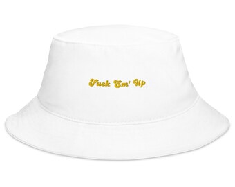 May include: White bucket hat with the text "Fuck Em' Up" embroidered in gold.