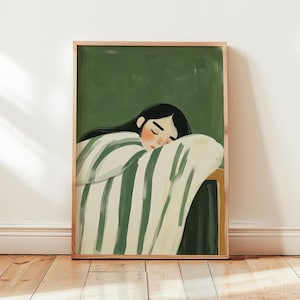 May include: A framed illustration of a person with long black hair sleeping under a green and white striped blanket against a green background.