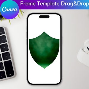 Puede incluir: Un marco verde en forma de escudo sobre un fondo blanco, que se muestra en la pantalla de un tel&eacute;fono inteligente. El escudo tiene un efecto borroso y brumoso, creando una profundidad de campo.