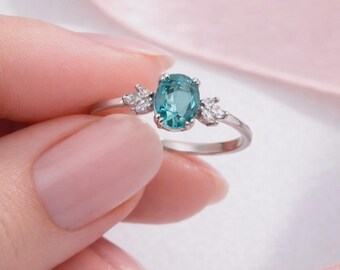 925 sterling silver rhodium plated ring with aquamarine stone.