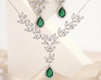 925 sterling silver double set with teardrop emerald stones.