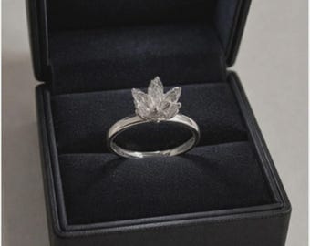 925 sterling silver rhodium plated lotus flower ring with adjustable base in illuminated box.