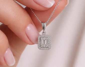 925 sterling silver necklace with baguette stones in an illuminated box.