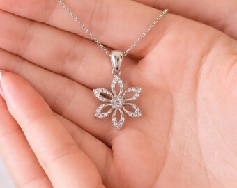 925 sterling silver rhodium plated star-shaped silver necklace in an illuminated box.