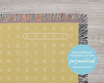 May include: A yellow woven blanket with a word search pattern featuring the name "BENNY" in a white circle. The blanket is made of 100% premium natural cotton and is personalized.