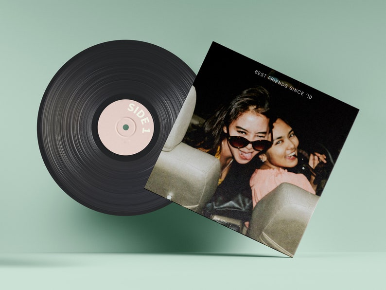 May include: A black vinyl record with a pink label that says "SIDE 1". The record is next to a black and white photo of two friends in a car. The photo has the text "BEST FRIENDS SINCE '10" at the top.