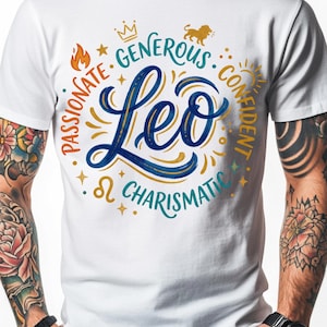 May include: White t-shirt featuring a Leo zodiac design. The design includes the word "Leo" in blue script, surrounded by words like "Passionate," "Generous," and "Confident" in a circular pattern. A crown, lion, and sun graphic are also included.