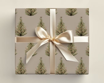 May include: A beige gift box with a gold ribbon and a repeating pattern of green Christmas trees with red berries.