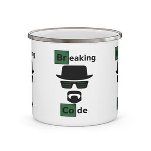 May include: A white enamel mug with a silver rim featuring a graphic design of a black hat, sunglasses with binary code, and a goatee. The text reads Breaking Code, with the Br and Co elements styled like periodic table squares in green.