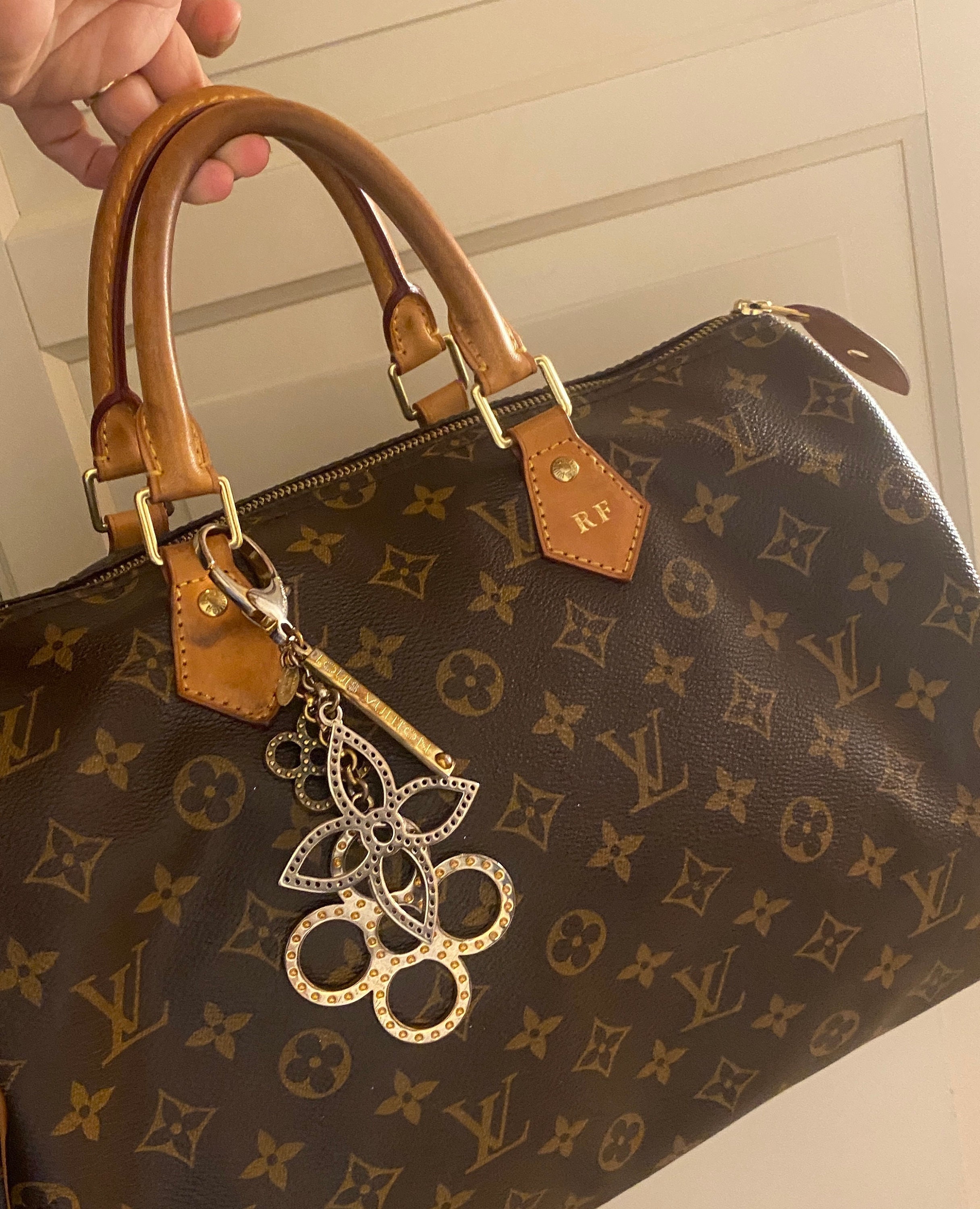 Bag charm Louis Vuitton Gold in Steel - 31754398