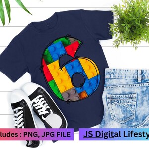 May include: A navy blue t-shirt with a number six made of colorful lego blocks. The text "includes: PNG, JPG FILE" is at the bottom left of the image. The text "JS Digital Lifestyle" is at the bottom right of the image.
