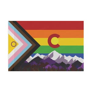 May include: A rectangular canvas print featuring a colorful design. The top portion displays a rainbow gradient, with a red "C" containing a yellow circle. Below, a mountain range and forest are depicted. The left side has a geometric design with various colors.