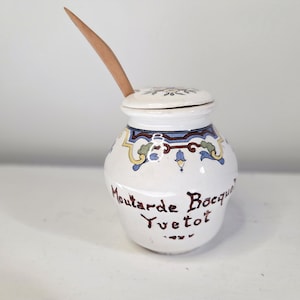 May include: A set of three ceramic mugs with a speckled, matte finish. The mugs are in shades of cream, light gray, and dark gray. Each mug has a simple, minimalist design, perfect for coffee or tea.