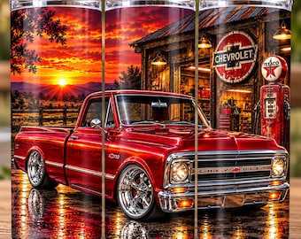 May include: A cylindrical tumbler featuring a vibrant sunset landscape with a red Chevrolet C10 pickup truck parked in front of a rustic garage. The garage displays a Chevrolet logo sign and a red Texaco gas pump. The design includes chrome wheels.