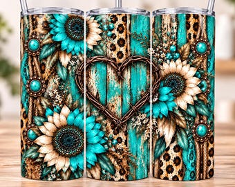May include: A cylindrical tumbler featuring a vibrant design of turquoise sunflowers, a central barbed wire heart, and leopard print accents over a weathered teal wood grain background, complete with a clear lid and a metal straw inserted at the top.