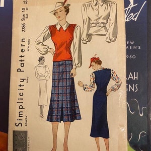 May include: Vintage Simplicity sewing pattern for a dress with a plaid skirt and a red top. The pattern number is 2286, size 12, bust 30. The pattern is printed on a cream background with black text.