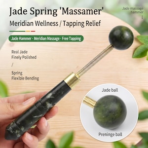 May include: A jade spring massager with a dark green jade ball and handle. The massager has a flexible spring and gold-colored metal accents. Text on the image reads "Jade Spring 'Massamer' Meridian Wellness / Tapping Relief."