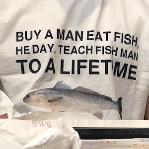 Buy a Man Eat Fish shirt Funny Meme Shirt Inappropriate Shirt Unhinged Shirt Weird Shirt Ironic Shirt Sarcastic Shirt Funny Gift Gen Z Shirt