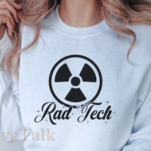 May include: A light blue sweatshirt with a black radiation symbol and the text "Rad Tech" in a stylized font.