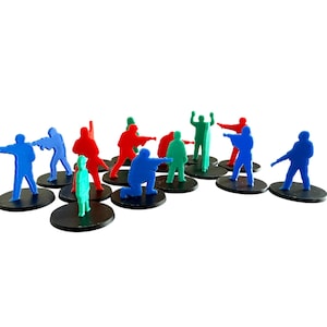 May include: A collection of colorful plastic game pieces in the shape of human figures. The figures are in various poses, including pointing, kneeling, and raising their arms. Each figure is mounted on a small, round black base.