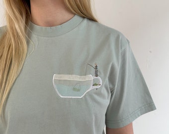 Unisex organic cotton t-shirt embroidered with tea bag anglers Pettersson and Findus