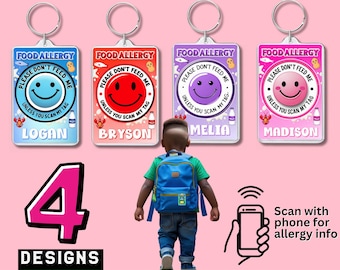 May include: Four food allergy alert keychains with different colored backgrounds and smiley faces. Each keychain has a name and the text "PLEASE DON'T FEED ME, UNLESS YOU SCAN MY TAG." The image also shows a child with a backpack and a phone with a scanning icon.