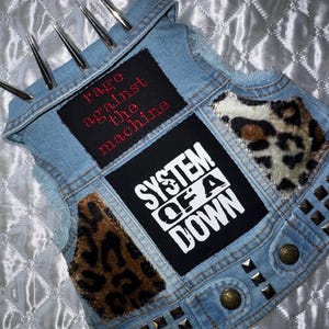 Medium Dog Vest featuring Rage Against The Machine and System Of A Down Patches , Giant Spikes and Studs on collar and Waist.