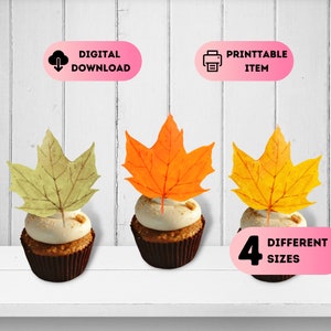 May include: Four printable cupcake toppers featuring autumn leaves in green, orange, and yellow. The toppers are available in four different sizes. The text "4 DIFFERENT SIZES" is displayed in pink.